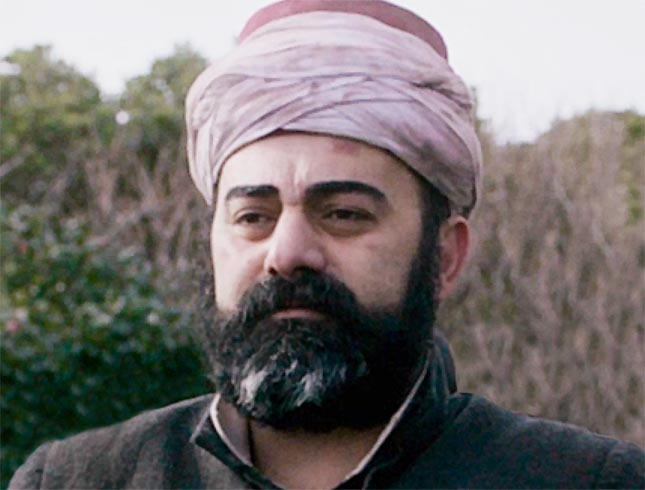 Mert Aygun starring in 125 Years Memory as Ali Efendi, an imam on the Ertugrul frigate